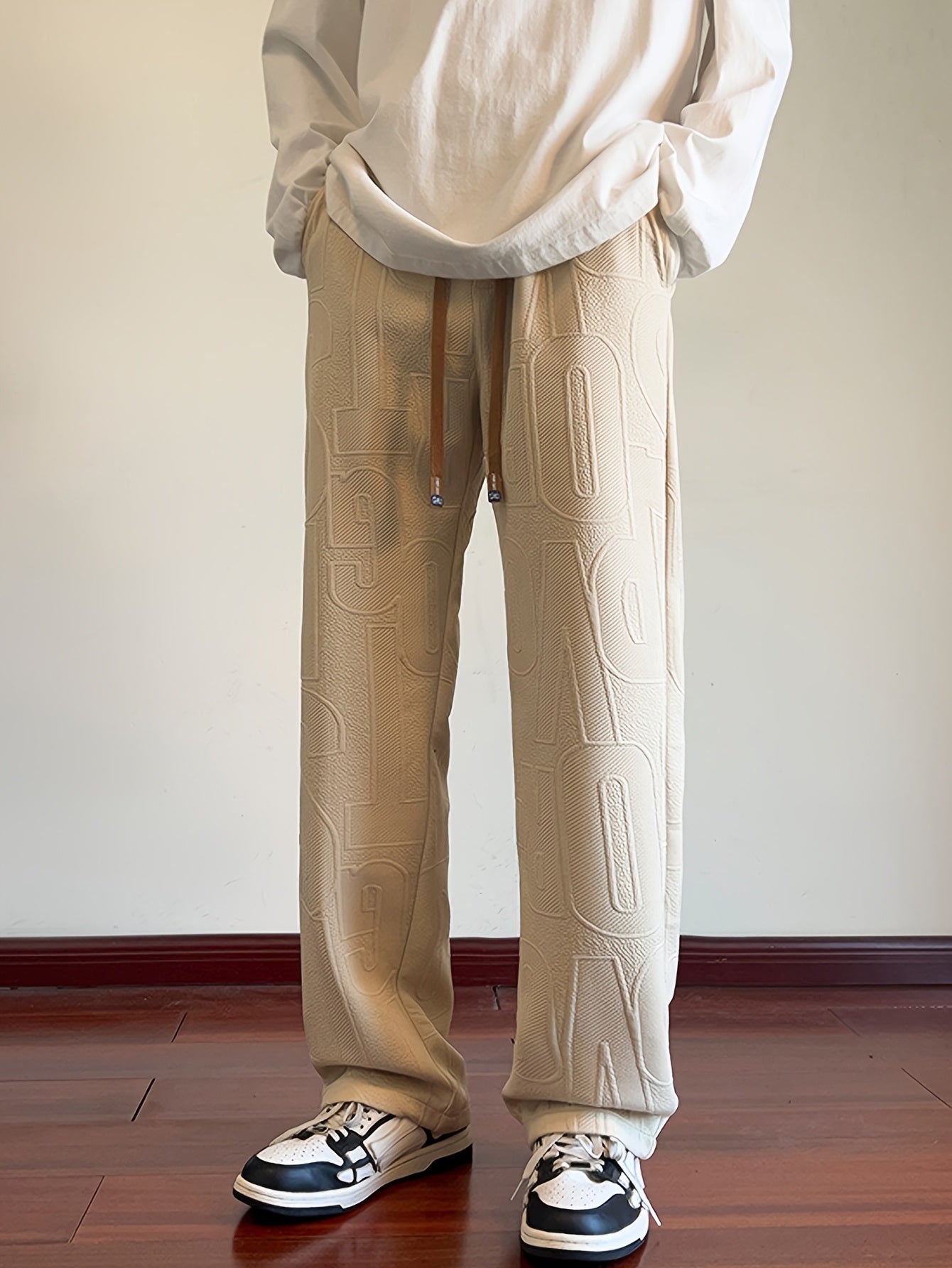 Pantalon droit d'automne pour homme, en tissu jacquard intégral, taille élastiquée avec cordon de serrage, idéal pour les activités décontractées de printemps et d'automne.