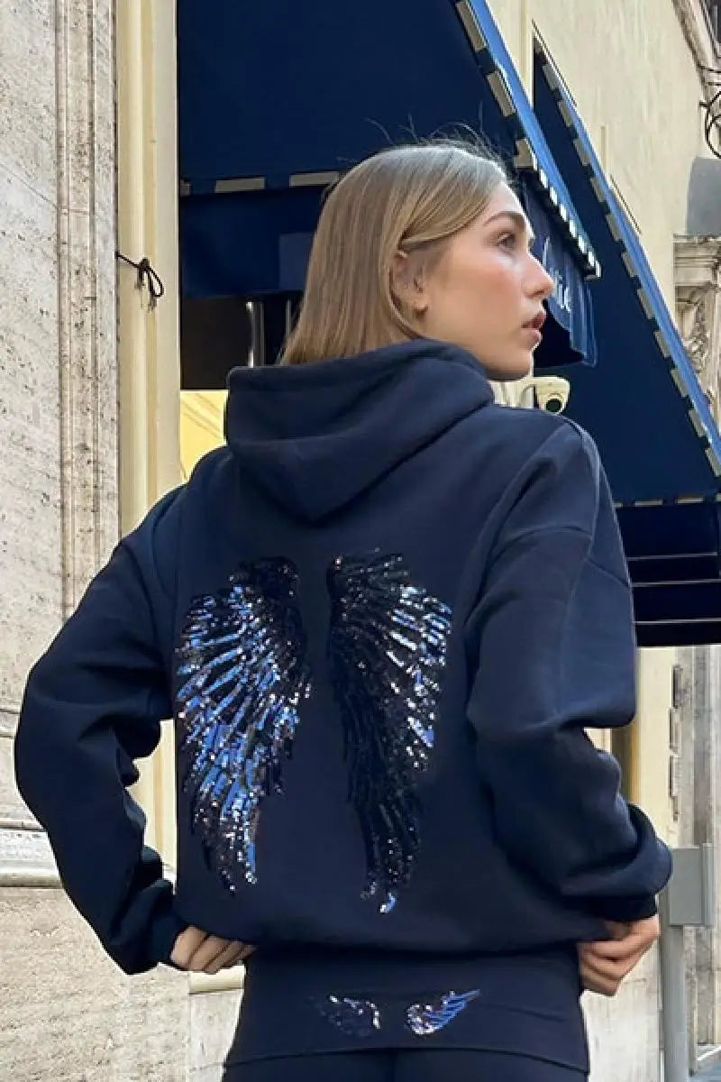 Ensemble sweat-shirt à capuche Free Wing pour femme, haut uni et pantalon long, collection 2026, style streetwear décontracté et unique.