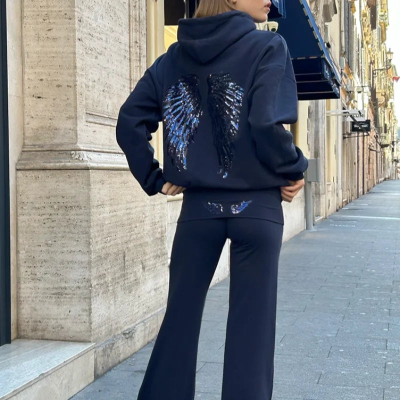 Ensemble sweat-shirt à capuche Free Wing pour femme, haut uni et pantalon long, collection 2026, style streetwear décontracté et unique.