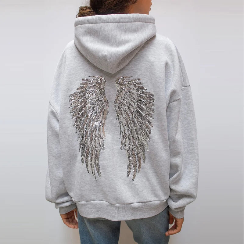 Ensemble sweat-shirt à capuche Free Wing pour femme, haut uni et pantalon long, collection 2026, style streetwear décontracté et unique.
