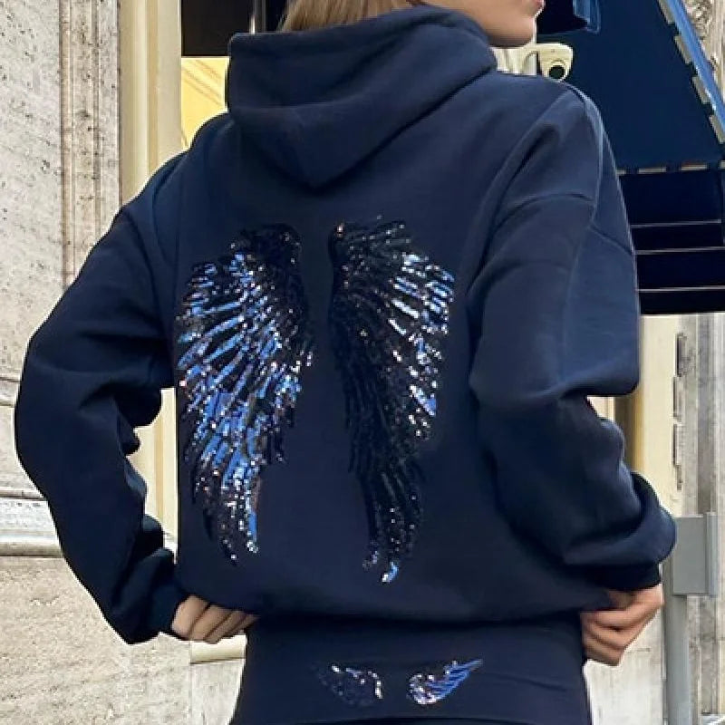 Ensemble sweat-shirt à capuche Free Wing pour femme, haut uni et pantalon long, collection 2026, style streetwear décontracté et unique.